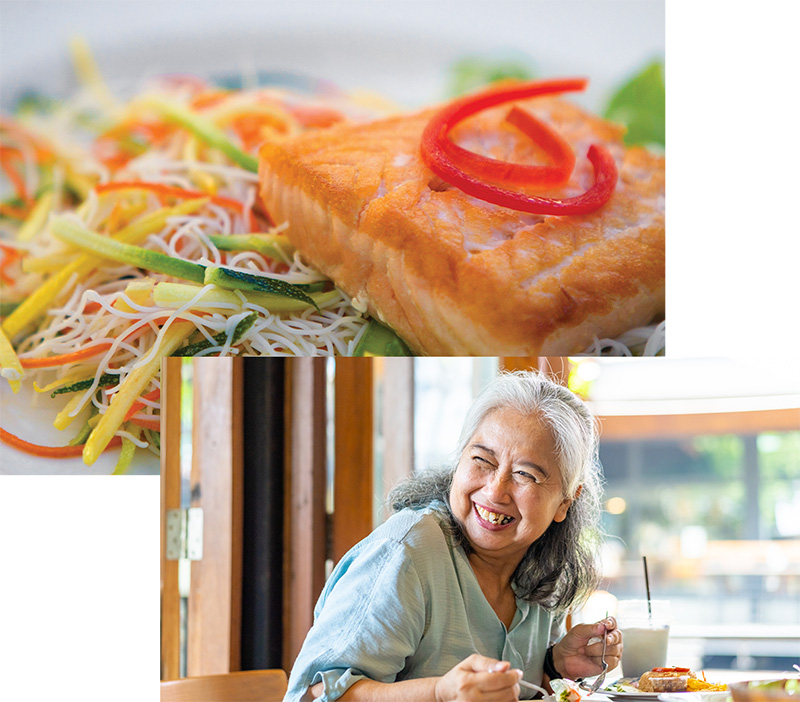senior woman smiling while having lunch