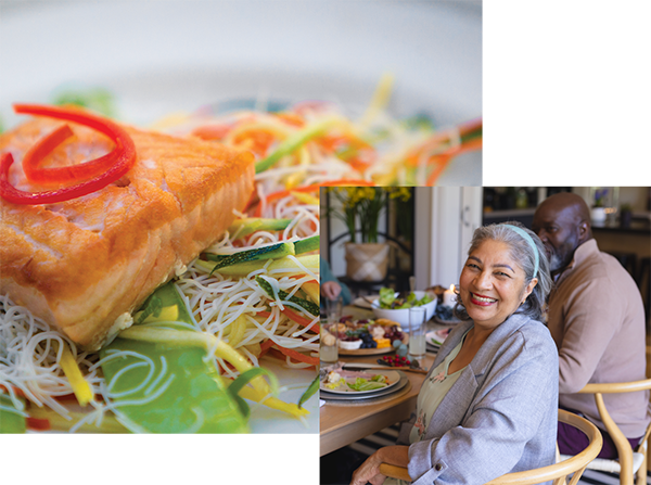 senior couple smiling while having lunch